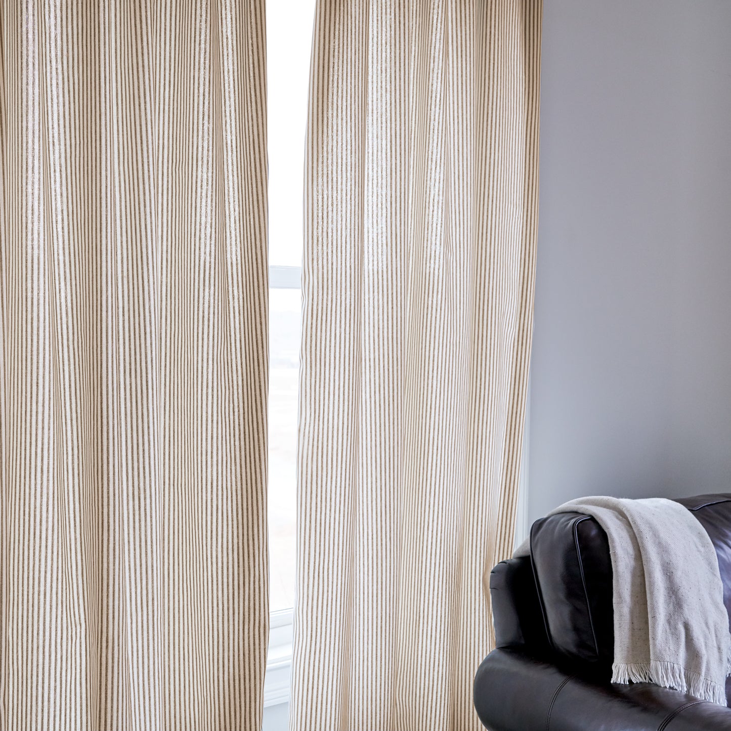 brown ticking stripe curtain panel in room 