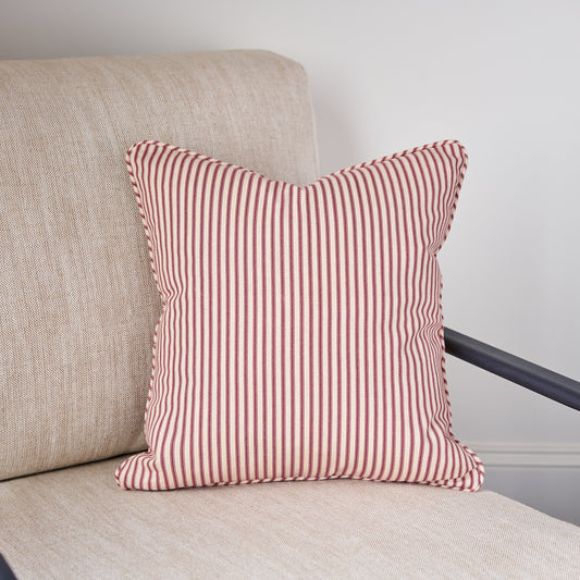 red ticking stripe throw pillow closeup in chair