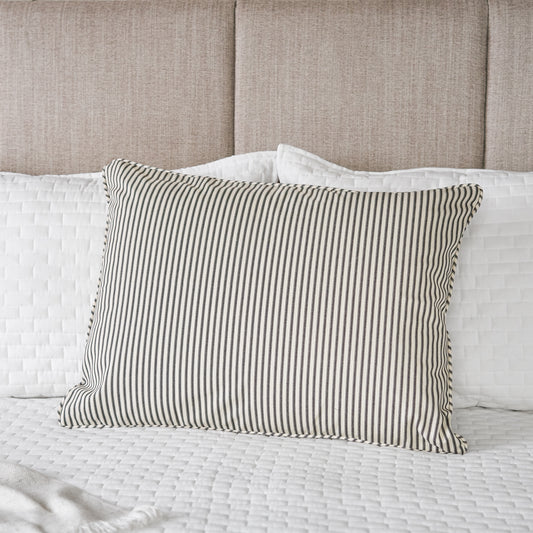 black and white ticking stripe fabric pillow sham on bed