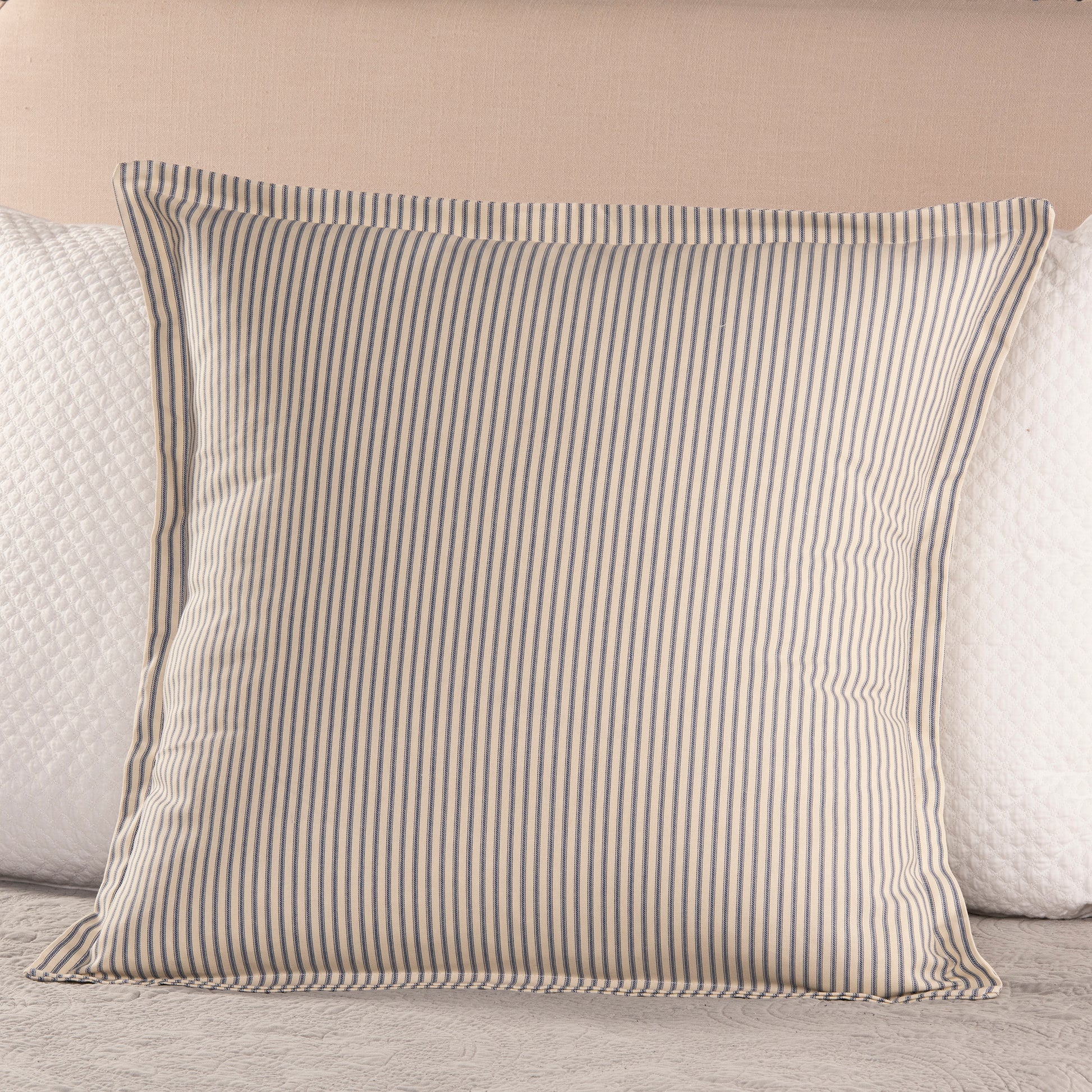 navy blue and cream ticking stripe sham euro size on bed