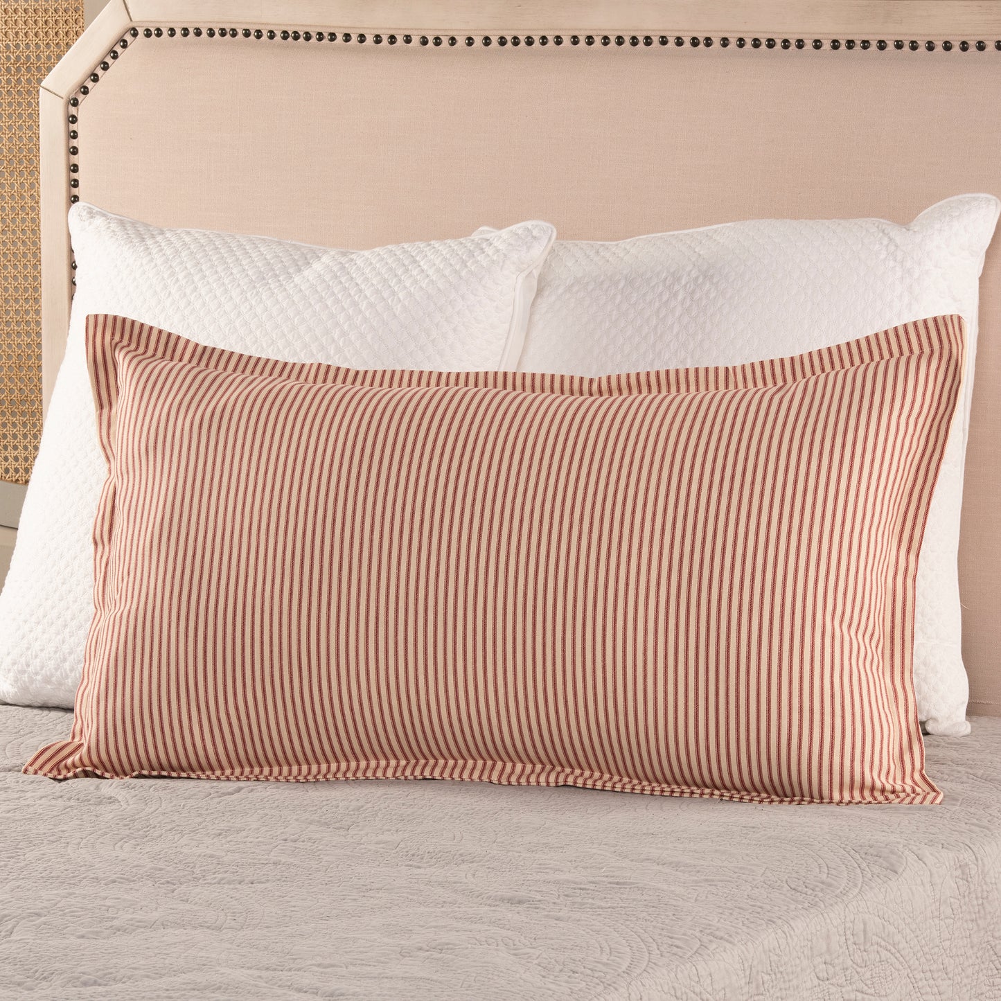 red ticking stripe king size pillow sham with flange detail on bed