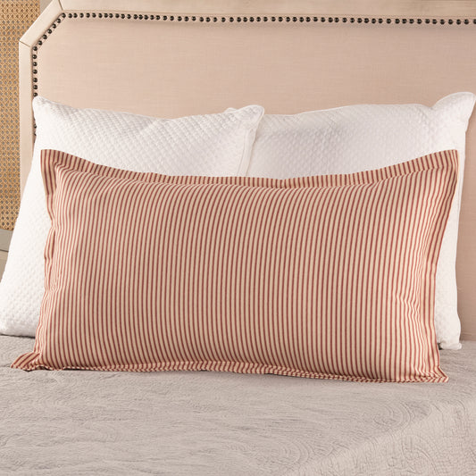 red ticking stripe king size pillow sham with flange detail on bed