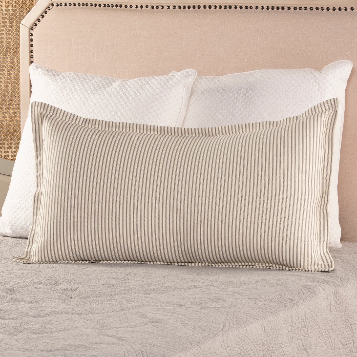 gray ticking stripe pillow sham with flange on bed