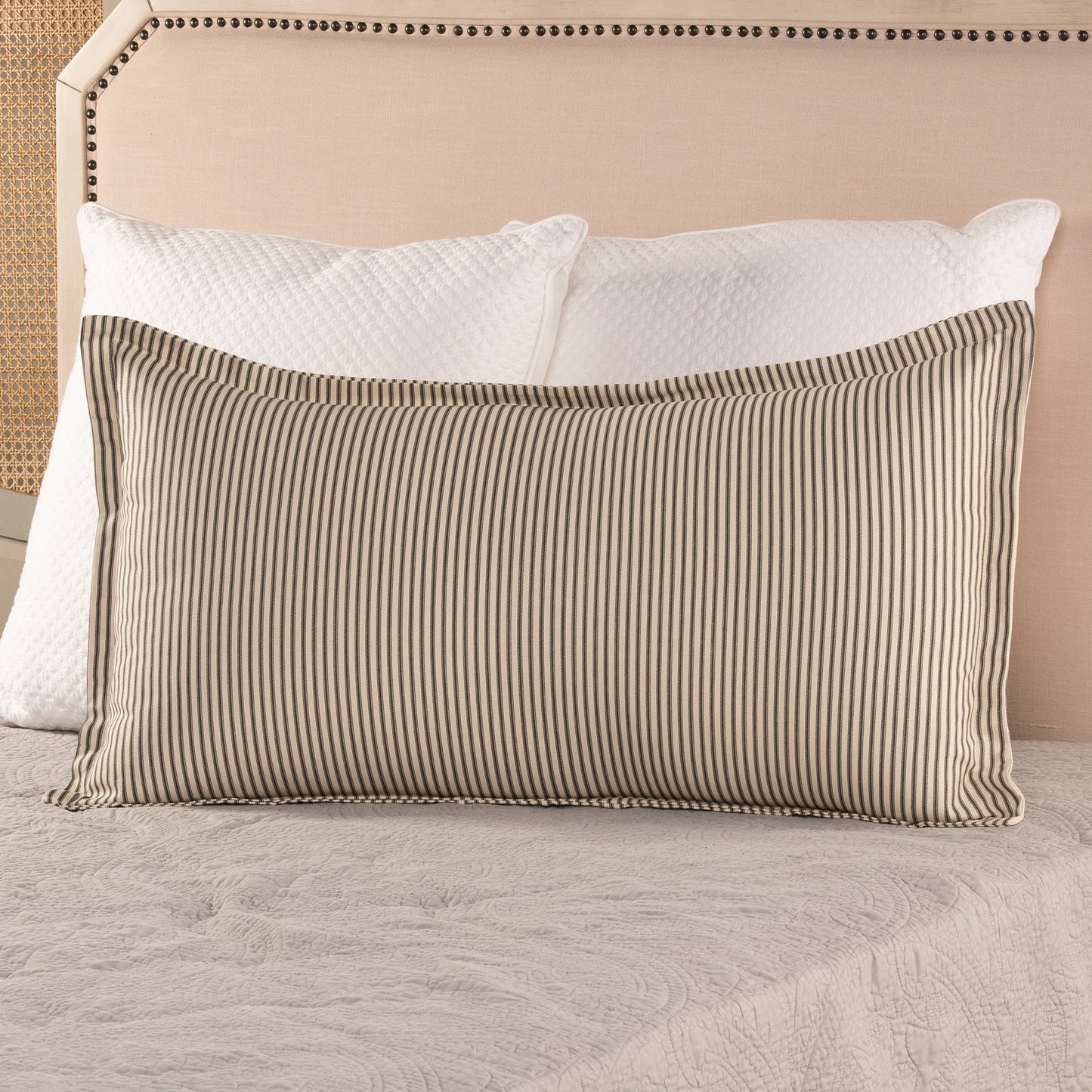 black ticking stripe pillow sham with flange detail on bed